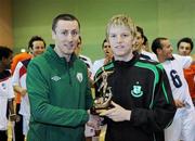 9 April 2011; Liam McGroarty, from the FAI, presents the player of the year trophy to the Shamrock Rovers player Ian Byrne. FAI Futsal Cup Final, EID Futsal v Blue Magic,  Gormanston College, Gormanston, Co. Meath. Picture credit: Matt Browne / SPORTSFILE