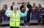 15 April 2011; Rita Lawlor, member of Council of Patrons Special Olympics Ireland, with her collection bucket as The Dublin Gospel Choir perform, during the Special Olympics Ireland’s annual collection day. This is the biggest annual fundraising event in aid of Special Olympics Ireland. Grafton Street, Dublin. Picture credit: Brian Lawless / SPORTSFILE