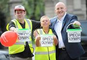 15 April 2011; Special Olympics volunteers Rita Lawlor, member of Council of Patrons Special Olympics Ireland, and Julian Shallow, from Blackrock, left, with Ireland rugby legend Keith Wood, during the Special Olympics Ireland’s annual collection day. This is the biggest annual fundraising event in aid of Special Olympics Ireland. Grafton Street, Dublin. Picture credit: Brian Lawless / SPORTSFILE