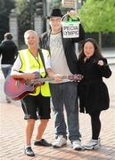 15 April 2011; Musician Darragh Cullen with Special Olympics collectors Rita Lawlor, member of Council of Patrons Special Olympics Ireland, left, and Mei Lin Yap, from Goatstown, Dublin, during the Special Olympics Ireland’s annual collection day. This is the biggest annual fundraising event in aid of Special Olympics Ireland. Grafton Street, Dublin. Picture credit: Brian Lawless / SPORTSFILE