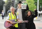 15 April 2011; Musician Darragh Cullen with Special Olympics collectors Rita Lawlor, member of Council of Patrons Special Olympics Ireland, left, and Mei Lin Yap, from Goatstown, Dublin, during the Special Olympics Ireland’s annual collection day. This is the biggest annual fundraising event in aid of Special Olympics Ireland. Grafton Street, Dublin. Picture credit: Brian Lawless / SPORTSFILE