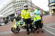 15 April 2011; Rita Lawlor, member of Council of Patrons Special Olympics Ireland, with Garda Ronan Moore, Pearse Street Station, during the Special Olympics Ireland’s annual collection day. This is the biggest annual fundraising event in aid of Special Olympics Ireland. Grafton Street, Dublin. Picture credit: Brian Lawless / SPORTSFILE