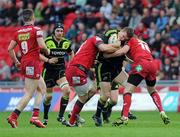 16 April 2011; Munster's Mike Sherry is tackled by Scarlets Rhys Priestland and Rhys M. Thomas. Celtic League, Scarlets v Munster, Parc Y Scarlets, Llanelli, Wales. Picture credit: Ian Cook / SPORTSFILE