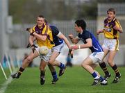 16 April 2011; Matthew O'Hanlon, Wexford, with support from team-mate Liam Óg McGovern, keeps the ball in play ahead of Michael Brady, right, and Gearóid McKiernan, centre, Cavan. Cadbury GAA All-Ireland Football U21 Championship Semi-Final, Cavan v Wexford, Parnell Park, Dublin. Picture credit: Barry Cregg / SPORTSFILE