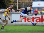 16 April 2011; Gearóid McKiernan, Cavan, takes a shot on goal ahead of Matthew O'Hanlon, Wexford. Cadbury GAA All-Ireland Football U21 Championship Semi-Final, Cavan v Wexford, Parnell Park, Dublin. Picture credit: Barry Cregg / SPORTSFILE