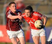 16 April 2011; Liam Jennings, Cork, in action against Eric Monaghan, Galway. Cadbury GAA All-Ireland Football U21 Championship Semi-Final, Cork v Galway, Cusack Park, Ennis, Co. Clare. Picture credit: Ray Ryan / SPORTSFILE