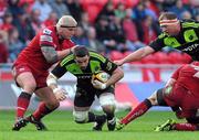 16 April 2011; Munster's Alan Quinlan is tackled by Scarlets Rhys M. Thomas. Celtic League, Scarlets v Munster, Parc Y Scarlets, Llanelli, Wales. Picture credit: Ian Cook / SPORTSFILE