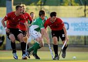 17 April 2011; Shane O'Donoghue, Ireland, in action against Kevin Laidman, left, and Adam Froese, Canada. Men's Hockey Test Series, Ireland v Canada, National Hockey Stadium, UCD, Belfield, Dublin. Picture credit: Barry Cregg / SPORTSFILE