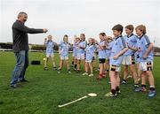 18 April 2011; All Black legend and Laureus Sport for Good Foundation goodwill ambassador Sean Fitzpatrick teaches members of the Kilmacud Crokes U12 Boys and Girls teams how to do 'The Haka'. Kilmacud Crokes GAA Club, Stillorgan, Co. Dublin. Picture credit: Stephen McCarthy / SPORTSFILE
