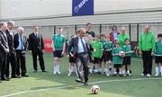 19 April 2011; UEFA President Michel Platini, under the watchful eyes of Cllr. Gerry Breen, Lord Mayor of Dublin, John Delaney, FAI CEO, and FAI President, Paddy McCaul, scores a goal, from the penalty spot, during his visit to see the Hardwicke F.C. club's facilities and the Football for All Programme while in Dublin for the UEFA Europa League Trophy Handover in advance of the UEFA Europa League final, to be played at the Aviva Stadium on Wednesday 18 May. Hardwicke Street, Dublin. Picture credit: Ray McManus / SPORTSFILE