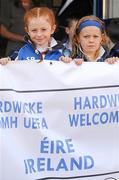 19 April 2011; Hardwicke Football Club children Sophie Perry, eight years, left, and six year old Abbie Smyth, await the arrival of the UEFA President, Michel Platini, who visited the club's facilities and the Football for All Programme while in Dublin for the UEFA Europa League Trophy Handover in advance of the UEFA Europa League final, to be played at the Aviva Stadium on Wednesday 18 May. Hardwicke Street, Dublin. Picture credit: Ray McManus / SPORTSFILE