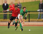 19 April 2011; Andy McConnell, Ireland, in action against Philip Wright, Canada. Men's Hockey Test Series, Ireland v Canada, NICSSA, Stormont, Belfast, Co. Antrim. Picture credit: Oliver McVeigh / SPORTSFILE