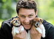 20 April 2011; Pictured at the launch of the 2011 Pedigree Adoption Drive is dog lover, Munster and Ireland rugby star David Wallace with his friends Jack Russell pups Zena, left, and Tia, from the ISPCA. 45 dogs are abandoned in Ireland every day, 17 dogs are put to sleep. In order to help curb these startling figures, Pedigree has teamed up David and Aoibhinn for the 2011 Annual Pedigree Adoption Drive. St. Stephen's Green, Dublin. Picture credit: Brian Lawless / SPORTSFILE