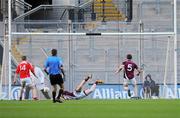 23 April 2011; Ronan Carroll, Louth, puts the ball past Westmeath goalkeeper Gary Connaughton to score his side's first goal. Allianz GAA Football Division 3 Final, Louth v Westmeath, Croke Park, Dublin. Picture credit: Barry Cregg / SPORTSFILE