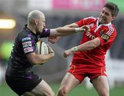23 April 2011; Richard Fussell, Ospreys, is tackled by Ronan O'Gara, Munster. Celtic League, Ospreys v Munster, Liberty Stadium, Swansea, Wales. Picture credit: Steve Pope / SPORTSFILE