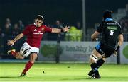 2 December 2016; Ian Keatly of Munster kicks a successful drop goal despite the attempts of Tim Swinson of Glasgow Warriors during the Guinness PRO12 Round 10 match at Scotstoun Stadium in Glasgow, Scotland. Photo by Paul Devlin/Sportsfile