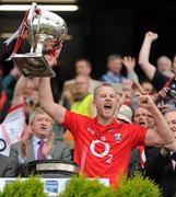 24 April 2011; Cork captain Michael Shields lifts the Allianz Football League Division 1 cup. Allianz Football League Division 1 Final, Dublin v Cork, Croke Park, Dublin. Picture credit: Stephen McCarthy / SPORTSFILE