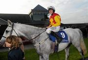 26 April 2011; Philip Enright enters the parade ring aboard Idarah after winning the Dan Moore Memorial Handicap Steeplechase. Fairyhouse Easter Festival, Fairyhouse Racecourse, Fairyhouse, Co. Meath. Picture credit: Brian Lawless / SPORTSFILE