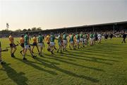 30 April 2011; Limerick and Clare players walk side by side during the parade before the start of the game. Allianz Hurling League Division 2 Final, Clare v Limerick, Cusack Park, Ennis, Co. Clare. Picture credit: David Maher / SPORTSFILE