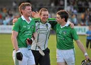 30 April 2011; Kevin Downes, left, Limerick, who scored his side's fourth goal, celebrates with team-mate Sean Tobin and a supporter at the end of the game. Allianz Hurling League Division 2 Final, Clare v Limerick, Cusack Park, Ennis, Co. Clare. Picture credit: David Maher / SPORTSFILE