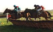 5 January 2002; I'vehadit, with Paul Wade up, left, jumps the last ahead of Lancero, with David Casey up, on their way to winning the at Fairyhouse Racecourse in Meath.  Photo by Brian Lawless/Sportsfile