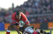 5 January 2002; Jim Williams of Munster is tackled by Matt Moore of Harlequins during the Heineken Cup Pool 4 Round 5 match between Munster and Harlequins at Thomond Park in Limerick. Photo by Matt Browne/Sportsfile