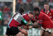 5 January 2002; Mick O'Driscoll of Munster supported by Jim Williams is tackled by David Slemen of Harlequins  during the Heineken Cup Pool 4 Round 5 match between Munster and Harlequins at Thomond Park in Limerick. Photo by Matt Browne/Sportsfile