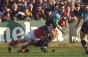 5 January 2002; Matt Moore of Harlequins is tackled by Dominic Crotty of Munster during the Heineken Cup Pool 4 Round 5 match between Munster and Harlequins at Thomond Park in Limerick. Photo by Matt Browne/Sportsfile