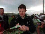 15 January 2002; Brian O'Driscoll signs autographs for fans after a Ireland Rugby squad training session and press conference at Thomond Park in Limerick. Photo by Brendan Moran/Sportsfile