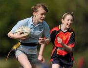 4 May 2011; Eimear Fitzpatrick, Rathfarnham Parish National School, escapes the attention of Abbey Pritchard, Scoil Ard Mhuire. Leinster Rugby Blitz, Tymon Park, Tallaght. Picture credit: Stephen McCarthy / SPORTSFILE