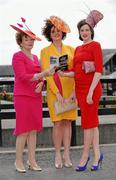 4 May 2011; Enjoying a day at the races, from left, are Marian Ahern with her daughters Grainne and Aisling all from Boyle, Co. Roscommon. Punchestown Irish National Hunt Festival 2011, Punchestown, Co. Kildare. Picture credit: Barry Cregg / SPORTSFILE