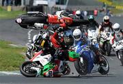 8 May 2011; Dylan Fox, 71, 1000cc Suzuki, flies into the air after colliding with Mark Pollock, 86, 1000cc Suzuki, centre, and also Brian McCormick, left, at the first corner of the second Superbike race. Adelaide Masters Series, Mondello Park International Racing Circuit, Donore, Naas, Co. Kildare. Picture credit: Barry Cregg / SPORTSFILE