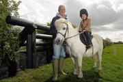 9 May 2011; Pictured at the launch of Tattersalls Ireland International Horse Trials & Country Fair 2011, in association with Horse Sport Ireland, are Ian Stark, cross country course designer, alongside 5 year old Tighe Wardell, from Dunlavin, Co. Wicklow, aboard Twilight the pony. Launch of Tattersalls Ireland International Horse Trials & Country Fair 2011, Tattersalls Ireland, Ratoath, Co. Meath. Photo by Sportsfile