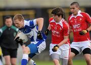 14 May 2011; Darren McMahon, Laois, in action against Evan Costello, right, and Brian Kenna, Louth. Leinster GAA Minor Football Championship Quarter-Final, Laois v Louth, O'Moore Park, Portlaoise, Co. Laois. Picture credit: Ray McManus / SPORTSFILE