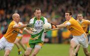 15 May 2011; Martin McElhinney, Donegal, in action against Anto Healey and Conor Murray, Antrim. Ulster GAA Football Senior Championship, Preliminary Round, Donegal v Antrim, MacCumhail Park, Ballybofey, Co. Donegal. Picture credit: Oliver McVeigh / SPORTSFILE