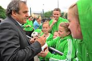 17 May 2011; UEFA President Michel Platini meets with children at the 2011 UEFA Europa League Final Grassroots Tournament. The tournament involved clubs and community groups from all across the City of Dublin. Irishtown Stadium, Ringsend, Dublin. Photo by Sportsfile