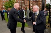 17 May 2011; UEFA General secretary Gianni Infantino is greeted by FAI President Paddy McCaul, as FAI CEO John Delaney looks on, at the opening of the new UEFA mini pitch in the Cabbage Patch, Dublin. The new mini pitch is a gift from UEFA to the city of Dublin to mark the Europa League Final on May 18th. Cabbage Patch, Kevin Street, Dublin. Photo by Sportsfile