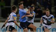 11 January 2017; Ryan Deegan of Dublin in action against UCD's from left, Seán Mullooly, Niall McInerney and Peter Healy during the Bord na Mona O'Byrne Cup Group 1 Round 2 match between Dublin and UCD at Parnell Park in Dublin. Photo by Piaras Ó Mídheach/Sportsfile