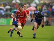 5 June 2011; Brian Dooher, Tyrone, in action against James Turley, Monaghan. Ulster GAA Football Senior Championship Quarter-Final, Healy Park, Tyrone v Monaghan, Omagh, Co. Tyrone. Picture credit: Oliver McVeigh / SPORTSFILE