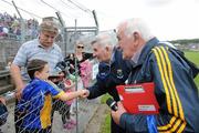 25 June 2011; Wicklow manager Mick O'Dwyer shakes hands with Cian Furlong, from Kiltegan, Co. Wicklow. GAA Football All-Ireland Senior Championship Qualifier Round 1, Wicklow v Sligo, County Grounds, Aughrim, Co. Wicklow. Picture credit: Matt Browne / SPORTSFILE