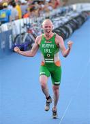 25 June 2011; Ireland's Conor Murphy, from Portadown, Co. Armagh, celebrates taking 38th position on the approach to the finish line during the Elite Men's race. 2011 Pontevedra ETU Triathlon European Championships - Elite Men, Pontevedra, Spain. Picture credit: Stephen McCarthy / SPORTSFILE