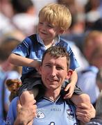 26 June 2011; Dublin supporter Liam Tilly, from Maynooth, Co.Kildare, with his son Alex at the end of the game. Leinster GAA Football Senior Championship Semi-Final, Dublin v Kildare, Croke Park, Dublin. Picture credit: David Maher / SPORTSFILE