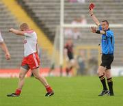 26 June 2011; Referee Joe McQuillan shows the red card to Kevin Hughes, Tyrone, after a second half incident. Ulster GAA Football Senior Championship Semi-Final, Tyrone v Donegal, St Tiernach's Park, Clones, Co. Monaghan. Picture credit: Oliver McVeigh / SPORTSFILE