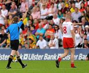 26 June 2011; Kevin Hughes, Tyrone, is shown the red card by referee Joe McQuillan for a second bookable offence. Ulster GAA Football Senior Championship Semi-Final, Tyrone v Donegal, St Tiernach's Park, Clones, Co. Monaghan. Picture credit: Michael Cullen / SPORTSFILE