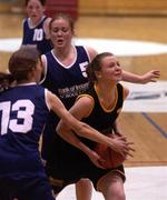 12 February 2002; Caoimhe Clancy of St Paul's in action against Katie Sweeney, 13, and Karen Barry of Colaiste Dun Iascaigh during the Bank of Ireland Schools Cup U19 &quot;B&quot; Girls Final match between Colaiste Dun Iascaigh, Cahir, Tipperary and St Paul's Secondary School, Oughterard, Galway, at the ESB Arena in Tallaght, Dublin. Photo by Brendan Moran/Sportsfile