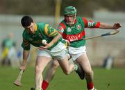 17 February 2002; Frankie McMullan of Dunloy, in action against Liam Power of Birr during the AIB All Ireland Club Hurling Championship Semi-Final match between Birr and Dunloy at St Tiernach's Park in Clones, Monaghan. Photo by Damien Eagers/Sportsfile