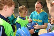 2 July 2011; Two of Centra's GAA Hurling Ambassadors for 2011, David O'Callaghan, Dublin, and Eoin Kelly, Tipperary, hosted a skills tour on Saturday 2nd of July in Parnell Park, Dubin. David and Eoin passed on their skills tips to 60 of Ireland's future hurlers as the Centra Skills Tour kicked off. Tipperary's Eoin Kelly signs autographs after the skills session. Parnell Park, Dublin. Picture credit: Pat Murphy / SPORTSFILE