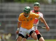 3 July 2011; Jackson McGreevy, Antrim, in action against Gerald Bradley, Derry. Ulster GAA Hurling Minor Championship Final, Antrim v Derry, Casement Park, Belfast, Co. Antrim. Picture credit: Pat Murphy / SPORTSFILE