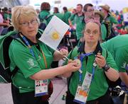 5 July 2011; Team Ireland, sponsored by eircom, returned with 107 medals from the 2011 Special Olympics World Summer Games in Athens. In total 126 athletes from Ireland competed in these prestigious World level Games which took place in Athens from 25th June - 4th July. Pictured as they depart for Dublin Airport are Table Tennis Coach, Phyllis Naughton, Galbally, Co. Limerick, and Team Ireland's Ann Marie Talbot, left, Enniscorthy, Co. Wexford, won a Gold Medal. Athens Airport, Greece. Picture credit: Ray McManus / SPORTSFILE