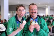 5 July 2011; Team Ireland, sponsored by eircom, returned with 107 medals from the 2011 Special Olympics World Summer Games in Athens. In total 126 athletes from Ireland competed in these prestigious World level Games which took place in Athens from 25th June - 4th July. Pictured as they depart for Dublin Airport are Team Ireland's Michael Glynn, Athlone, Co. Roscommon, and fellow Roscommon man Adrian Cornwall, who now resides in Tonphubble, Co. Sligo. Athens Airport, Greece. Picture credit: Ray McManus / SPORTSFILE